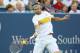 MASON, OH - AUGUST 17: Mardy Fish hits a forehand against Roger Federer of Switzerland during day seven of the Western & Southern Open at Lindner Family Tennis Center on August 17, 2012 in Mason, Ohio. (Photo by Nick Laham/Getty Images)
