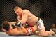 LAS VEGAS - JULY 11: Brock Lesnar holds down Frank Mir during their heavyweight title bout during UFC 100 on July 11, 2009 in Las Vegas, Nevada. Lesnar defeated Mir by a second round knockout. (Photo by Jon Kopaloff/Getty Images)