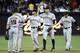 SAN DIEGO, CA - AUGUST 17: San Francisco Giants players high-five after beating the San Diego Padres 10-1 in a baseball game at Petco Park on August 17, 2012 in San Diego, California. (Photo by Denis Poroy/Getty Images)