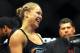 August 18, 2012; San Diego, CA, USA; Ronda Rousey (black shirt) celebrates after she defeated Sarah Kaufman (not pitcured) during their Strikeforce MMA women's bantamweight title bout at the Valley View Casino Center. Rousey won in 54 seconds of the first round. Mandatory Credit: Jayne Kamin-Oncea-US PRESSWIRE