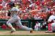ST. LOUIS, MO - AUGUST 19: Andrew McCutchen #22 of the Pittsburgh Pirates hits an RBI single against the St. Louis Cardinals at Busch Stadium on August 19, 2012 in St. Louis, Missouri. (Photo by Dilip Vishwanat/Getty Images)