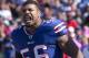 ORCHARD PARK, NY - OCTOBER 09: Shawne Merriman #56 of the Buffalo Bills celebrates as he enters the stadium during pregame introductions against the Philadelphia Eagles at Ralph Wilson Stadium on October 9, 2011 in Orchard Park, New York. (Photo by Brody Wheeler/Getty Images)