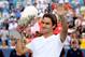 MASON, OH - AUGUST 19: Roger Federer of Switzerland celebrates with the winner's trophy after defeatng Novak Djokovic of Serbia during the final of the Western & Southern Open at the Lindner Family Tennis Center on August 19, 2012 in Mason, Ohio. (Photo by Matthew Stockman/Getty Images)