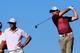 KIAWAH ISLAND, SC - AUGUST 09: Rory McIlroy of Northern Ireland hits off the 14th tee as Dustin Johnson of the United States looks on during Round One of the 94th PGA Championship at the Ocean Course on August 9, 2012 in Kiawah Island, South Carolina. (Photo by David Cannon/Getty Images)