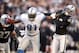 OAKLAND, CA - DECEMBER 18: Calvin Johnson #81 of the Detroit Lions tries to break free from DeMarcus Van Dyke #23 of the Oakland Raiders at O.co Coliseum on December 18, 2011 in Oakland, California. (Photo by Ezra Shaw/Getty Images)
