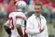 April 21, 2012; Columbus, OH, USA; Ohio State Buckeyes head coach Urban Meyer talks with quarterback Ken Guiton (13) after an interception during the spring game at Ohio Stadium. The Scarlet team won the game 20-14. Mandatory Credit: Greg Bartram-US PRESSWIRE