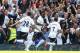 LONDON, ENGLAND - MAY 13: Emmanuel Adebayor of Tottenham Hotspur celebrates scoring the opening goal with team mates Kyle Walker and Aaron Lennon during the Barclays Premier League match between Tottenham Hotspur and Fulham at White Hart Lane on May 13, 2012 in London, England. (Photo by Clive Rose/Getty Images)