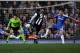 LONDON, ENGLAND - MAY 02: Papiss Cisse of Newcastle scores the opening goal despite the efforts from Branislav Ivanovic (L) and John Terry of Chelsea during the Barclays Premier League match between Chelsea and Newcastle United at Stamford Bridge on May 2, 2012 in London, England. (Photo by Ian Walton/Getty Images)