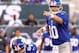 Aug. 18, 2011; East Rutherford, NJ, USA; New York Giants quarterback Eli Manning (10) yells out the plays as center David Baas (64) waits to snap the ball against the New York Jets against the New York Jets during the first quarter at MetLife Stadium. Mandatory Credit: Debby Wong-US PRESSWIRE