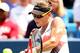 MASON, OH - AUGUST 17: Samantha Stosur of Australia returns a shot to Venus Williams during the Western & Southern Open at the Lindner Family Tennis Center on August 17, 2012 in Mason, Ohio. (Photo by Matthew Stockman/Getty Images)