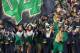SOUTH BEND, IN - OCTOBER 29: The leprechaun and cheerleaders for the Notre Dame Fighting Irish run onto the field before a game against the Navy Midshipmen at Notre Dame Stadium on October 29, 2011 in South Bend, Indiana. (Photo by Jonathan Daniel/Getty Images)