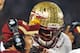ORLANDO, FL - DECEMBER 29: Coach Jimbo Fisher gives a play to quarterback E. J. Manuel #3 of the Florida State Seminoles during play against the Notre Dame Fighting Irish in the Champs Sports Bowl December 29, 2011 at the Florida Citrus Bowl in Orlando, Florida. FSU won 18 - 14. (Photo by Al Messerschmidt/Getty Images)