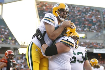 Aaron Rodgers celebrates a touchdown run.