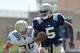 Aug. 19, 2011; South Bend, IN, USA; Notre Dame Fighting Irish quarterback Everett Golson (5) is chased by linebacker Ben Councell (30) during practice at the LaBar Practice Complex. Mandatory Credit: Matt Cashore-US PRESSWIRE