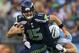 SEATTLE, WA - AUGUST 11: Quarterback Matt Flynn #15 of the Seattle Seahawks rushes against Zach Clayton #69 of the Tennessee Titans at CenturyLink Field on August 11, 2012 in Seattle, Washington. (Photo by Otto Greule Jr/Getty Images)
