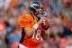 DENVER, CO - AUGUST 18: Quarterback Peyton Manning #18 of the Denver Broncos looks to pass during the first quarter against the Seattle Seahawks at Sports Authority Field Field at Mile High on August 18, 2012 in Denver, Colorado. (Photo by Justin Edmonds/Getty Images)