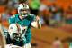 August 10, 2012; Miami Gardens, FL, USA; Miami Dolphins quarterback Ryan Tannehill (17) calls the play during the second half of the game against the Tampa Bay Buccaneers at Sun Life Stadium. Tampa Bay won the game 20-7. Mandatory Credit: Brad Barr-US PRESSWIRE