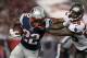 August 24, 2011; Tampa, FL, USA; New England Patriots running back Stevan Ridley (22) stiff arms Tampa Bay Buccaneers cornerback Leonard Johnson (29) during the second half at Raymond James Stadium. Tampa Bay Buccaneers defeated the New England Patriots 30-28. Mandatory Credit: Kim Klement-US PRESSWIRE