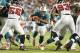 MIAMI GARDENS, FL - AUGUST 24: Daniel Thomas #33 of the Miami Dolphins runs with the ball against the Atlanta Falcons during a preseason game on August 24, 2012 at Sun Life Stadium in Miami Gardens, Florida. (Photo by Joel Auerbach/Getty Images)