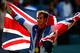 LONDON, ENGLAND - AUGUST 05: Andy Murray of Great Britain poses with his gold and silver medals holding a union jack after the medal ceremony for the Mixed Doubles Tennis on Day 9 of the London 2012 Olympic Games at the All England Lawn Tennis and Croquet Club on August 5, 2012 in London, England. (Photo by Paul Gilham/Getty Images)