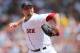BOSTON, MA - AUGUST 8: Josh Beckett #19 of the Boston Red Sox throws in the first inning against the Texas Rangers at Fenway Park August 8, 2012 in Boston, Massachusetts. (Photo by Jim Rogash/Getty Images)