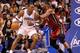 ORLANDO, FL - MARCH 13: Dwight Howard #12 of the Orlando Magic is guarded by Chris Bosh #1 of the Miami Heat during the game at Amway Center on March 13, 2012 in Orlando, Florida. NOTE TO USER: User expressly acknowledges and agrees that, by downloading and or using this photograph, User is consenting to the terms and conditions of the Getty Images License Agreement. (Photo by Sam Greenwood/Getty Images)