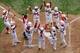 SOUTH WILLAMSPORT, PA - AUGUST 25: Noriatsu Osaka #10 (L) of team Japan celebrates after hitting a three run home run against team Panama during the fourth inning of their Little League World Series on August 25, 2012 in South Willamsport, Pennsylvania. (Photo by Rob Carr/Getty Images)