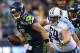 SEATTLE, WA - AUGUST 11: Quarterback Matt Flynn #15 of the Seattle Seahawks rushes against Zach Clayton #69 of the Tennessee Titans at CenturyLink Field on August 11, 2012 in Seattle, Washington. (Photo by Otto Greule Jr/Getty Images)