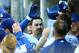 LOS ANGELES, CA - AUGUST 25: First baseman Adrian Gonzalez #23 of the Los Angeles Dodgers celebrates in the dugout after hitting a three run home run in his first at bat as a Dodger in the first inning against the Miami Marlins on August 25, 2012 at Dodger Stadium in Los Angeles, California. (Photo by Stephen Dunn/Getty Images)