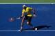 NEW YORK, NY - SEPTEMBER 09: John Isner of the United States returns a shot against Andy Murray of Great Britain during Day Twelve of the 2011 US Open at the USTA Billie Jean King National Tennis Center on September 9, 2011 in the Flushing neighborhood of the Queens borough of New York City. (Photo by Chris Trotman/Getty Images)
