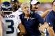 Coach Pete Carroll praises Russell Wilson as he comes to the sideline.