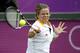 LONDON, ENGLAND - JULY 30: Kim Clijsters of Belgium hits a forehand during her second round match against Carla Suarez Navarro of Spain on Day 3 of the London 2012 Olympic Games at the All England Lawn Tennis and Croquet Club in Wimbledon on July 30, 2012 in London, England. (Photo by Jamie Squire/Getty Images)