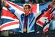Aug 5, 2012; London, United Kingdom; Andy Murray (GBR) celebrates with a flag and gold medal after defeating Roger Federer (SUI) in the men's singles final during the London 2012 Olympic Games at Wimbledon. Mandatory Credit: Christopher Hanewinckel-USA TODAY Sports