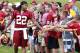 July 27, 2012; Ashburn, VA, USA; Washington Redskins defensive back Kevin Barnes (22) shakes hands with fans while walking to the field during Redskins training camp at Redskins Park. Mandatory Credit: Geoff Burke-US PRESSWIRE