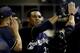 MILWAUKEE, WI - AUGUST 20: Carlos Gomez #27 of the Milwaukee Brewers celebrates in the dugout after getting hit home on a single hit by Travis Ishikawa in the bottom of the 5th inning against the Chicago Cubs at Miller Park on August 20, 2012 in Milwaukee, Wisconsin. (Photo by Mike McGinnis/Getty Images)