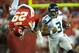 Aug 24, 2012; Kansas City, MO, USA; Seattle Seahawks quarterback Russell Wilson (3) outruns Kansas City Chiefs safety Eric Berry (29) in the first half at Arrowhead Stadium. Mandatory Credit: John Rieger-US PRESSWIRE