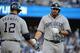 LOS ANGELES, CA - JULY 14: Carlos Quentin #18 of the San Diego Padres celebrates with teammate Yasmani Grandal #12 after hitting a homerun in the fourth inning against the Los Angeles Dodgers at Dodger Stadium on July 14, 2012 in Los Angeles, California. (Photo by Lisa Blumenfeld/Getty Images)