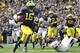 ANN ARBOR, MI - OCTOBER 01: Denard Robinson #16 of the Michigan Wolverines runs 9 yards for a first quarter touchdown during the game against the Minnesota Golden Gophers at Michigan Stadium on October 1, 2011 in Ann Arbor, Michigan. (Photo by Leon Halip/Getty Images)