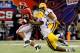 NEW ORLEANS, LA - JANUARY 09: Trent Richardson #3 of the Alabama Crimson Tide breaks a tackle from Barkevious Mingo #49 of the Louisiana State University Tigers on his way to a 34-yard touchdown run in the fourth quarter during the 2012 Allstate BCS National Championship Game at Mercedes-Benz Superdome on January 9, 2012 in New Orleans, Louisiana. (Photo by Kevin C. Cox/Getty Images)