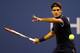 NEW YORK, NY - AUGUST 27: Roger Federer of Switzerland returns a shot during his men's singles first round match against Donald Young of the United States on Day One of the 2012 US Open at USTA Billie Jean King National Tennis Center on August 27, 2012 in the Flushing neigborhood of the Queens borough of New York City. (Photo by Al Bello/Getty Images)