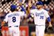 KANSAS CITY, MO - AUGUST 28: Eric Hosmer #35 and Mike Moustakas #8 of the Kansas City Royals celebrate after the Royals defeated the Detroit Tigers 9-8 to win the game at Kauffman Stadium on August 28, 2012 in Kansas City, Missouri. (Photo by Jamie Squire/Getty Images)