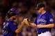 DENVER, CO - AUGUST 28: Catcher Wilin Rosario #20 of the Colorado Rockies congratulates relief pitcher Matt Reynolds #51 as he exits the game in the seventh inning against the Los Angeles Dodgers at Coors Field on August 28, 2012 in Denver, Colorado. Reynolds gave up no hits and no runs in one and one third innings of work en route to helping the Rockies defeat the Dodgers 8-4. (Photo by Justin Edmonds/Getty Images)