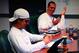 Miami Dolphins QB's Ryan Tannehill (right) and Matt Moore (left) conversing over Tannehill not knowing NFL divisions.