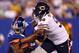 EAST RUTHERFORD, NJ - AUGUST 24: Julius Peppers #90 of the Chicago Bears shoves Rueben Randle #82 of the New York Giants during a preseason game on August 24, 2012 at MetLife Stadium in East Rutherford, New Jersey. (Photo by Elsa/Getty Images)