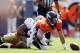 August 26, 2012; Denver, CO, USA; Denver Broncos quarterback Caleb Hanie (16) recovers the football after being tackled by San Francisco 49ers defensive tackle Wil Tukuafu (92) during the second quarter against the Denver Broncos at Sports Authority Field at Mile High. Mandatory Credit: Chris Humphreys-US PRESSWIRE