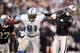 Detroit Lions WR Calvin Johnson stiff arms an Oakland Raiders defensive player on Sunday Dec. 18th 2011.