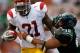 HONOLULU - SEPTEMBER 2: Allen Bradford #9 of the University of Southern California Trojans carries the ball as he is tackled by Haku Correa #99 of the University of Hawaii Warriors during first half action at Aloha Stadium September 2, 2010 in Honolulu, Hawaii. (Photo by Kent Nishimura/Getty Images)
