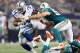 ARLINGTON, TX - AUGUST 29: Phillip Tanner #34 of the Dallas Cowboys runs the ball past Austin Spitler #53 of the Miami Dolphins during a preseason game at Cowboys Stadium on August 29, 2012 in Arlington, Texas. (Photo by Ronald Martinez/Getty Images)