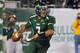 TAMPA, FL - DECEMBER 1: Quarterback B. J. Daniels #7 of the South Florida Bulls sets to pass against the West Virginia Mountaineers December 1, 2011 at Raymond James Stadium in Tampa, Florida. (Photo by Al Messerschmidt/Getty Images)