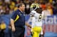 NEW ORLEANS, LA - JANUARY 03: Head coach Brady Hoke of the Michigan Wolverines talks with J.T. Floyd #8 against the Virginia Tech Hokies during the Allstate Sugar Bowl at Mercedes-Benz Superdome on January 3, 2012 in New Orleans, Louisiana. (Photo by Kevin C. Cox/Getty Images)